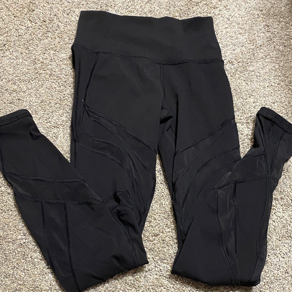 Black Lululemon leggings with mesh details